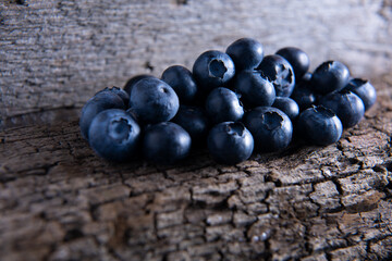 Blueberries on a wooden background with nice shadows.