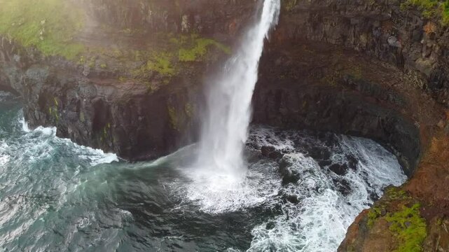 Drone shot of M&uacute;lafossur waterfall in Faroe Islands