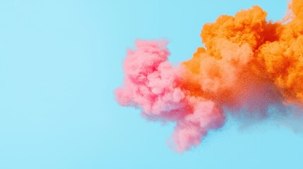 Fototapeta premium A vibrant explosion of pink and orange smoke against a bright blue background, creating a dynamic and colorful visual effect.