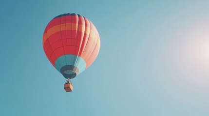 Naklejka premium A colorful hot air balloon rising into a clear blue sky.