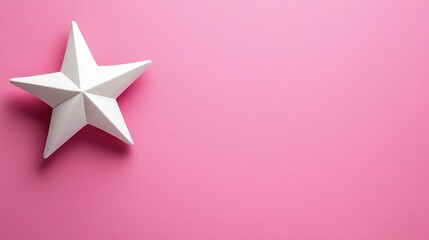 A white, three-dimensional star rests on a vibrant pink background, creating a striking contrast and a playful aesthetic.