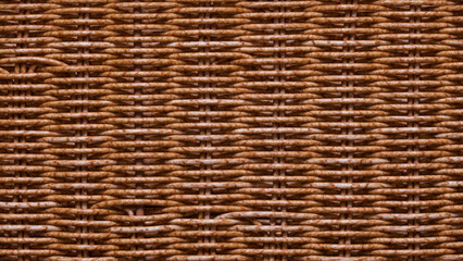 Close-up of the wall of a basket woven from natural wicker. Background. Pattern. Texture.