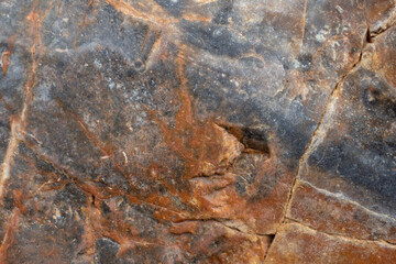 Brown stone texture, background. Close-up of stone surface.