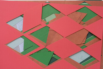 mixed machine-cut paper with diamond or rhombus form cutouts arranged in layered form