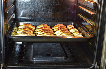 Croissants are baked in a gas oven.