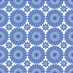 seamless pattern of blue and white ethnic floral tribal mandala motif for wallpaper and tile