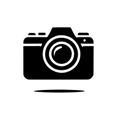 Camera Icon: A simple yet powerful black silhouette of a digital camera with a lens, casting a subtle shadow, perfect for websites, apps, and social media graphics.
