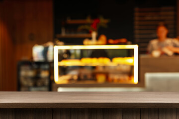 Empty wooden table in stylish cafe. Space for design