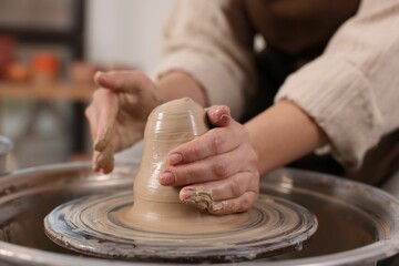 Hobby and craft. Woman making pottery indoors, closeup