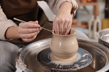 Hobby and craft. Woman making pottery indoors, closeup