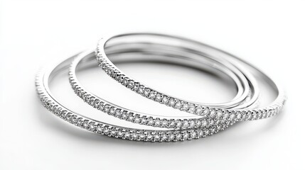 A set of delicate diamond bangles on a white isolated background