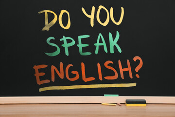Do You Speak English? text on black chalkboard. Language course