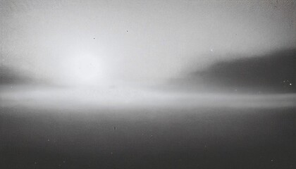 Vintage monochromatic distressed abstract old photo of foggy sunrise, film grain, dust and scratches texture effect