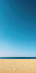 Fototapeta premium Calm beach with clear blue sky and gentle waves