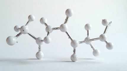 Obraz premium A Complex Molecular Structure Model White Spheres and Metallic Bonds on a Neutral Background