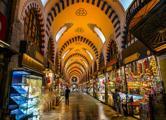 Vibrant Traditional spice Market With Decorative Arched Ceiling and Brightly Lit Colorful Stalls,...