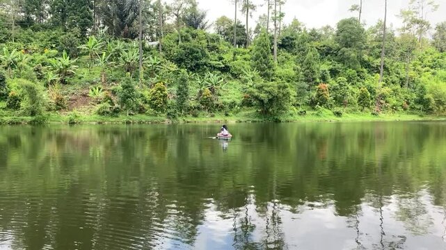 Hidden in the pine forests of Gununglurah, Telaga Kumpe is a serene mountain lake nestled on Mount Slamet's slopes. 