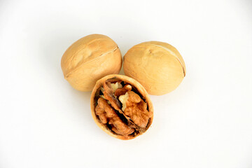 Cracked Walnuts on the white background top view