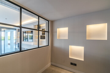 an image of abstract illuminated shelving in luxurious mediterranean real estate 