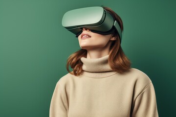 Woman wearing virtual reality headset exploring metaverse on green background