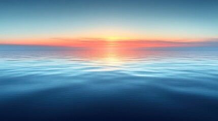 Obraz premium Calm ocean water with a sunrise reflecting on the surface.
