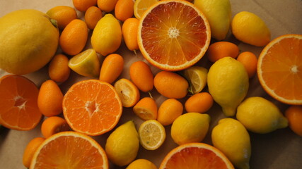 Citrus fruits, sicilian mini lemon and tarocco orange, clementines, kumquat, seasonal fruits, high vitamin c, energy boost, antioxidant fruits, fruits on table, italy