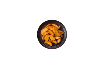 Baked potato wedges with cheese and herbs on a white background