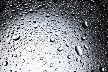 Water drops on glass surface, top view
