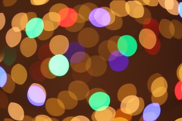 Blurred view of colorful lights on color background, bokeh effect