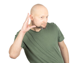 Curious man listening attentively with hand to ear