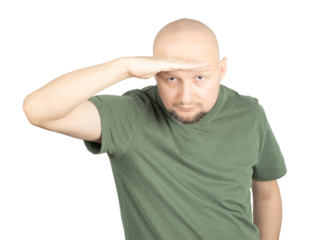 Curious man looking into the distance with a hand salute