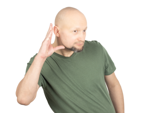 Curious man listening attentively with hand to ear