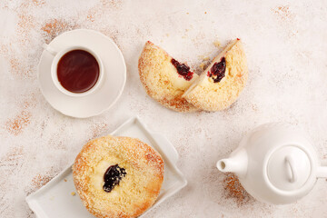 Homemade vatrushki, Russian round pastry with cottage cheese and sour cherry jam.