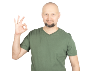 Smiling man making an OK hand gesture in studio portrait