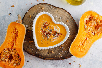Traditional autumn butternut squash soup with seeds.