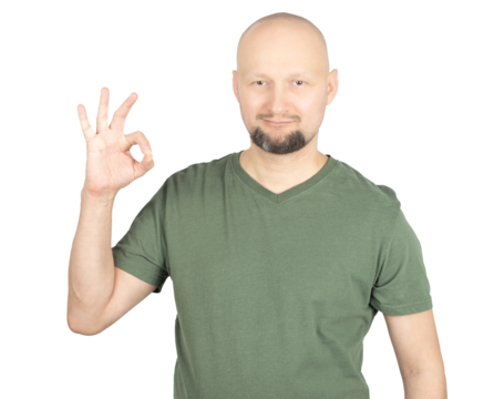 Smiling man making an OK hand gesture in studio portrait