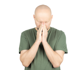 Worried bald man in green t-shirt pressing hands together