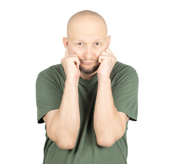 Worried man pressing his fists against his cheeks