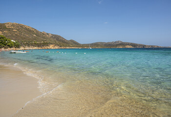 Obraz premium Aerial view of Tuerredda bay with the beach of fine sand and transparent blue and turquoise water