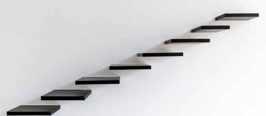 Black floating shelves ascending diagonally on a white wall.