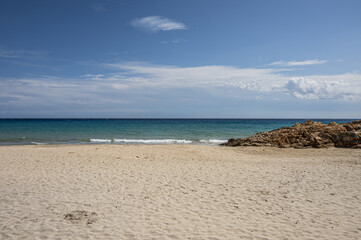 The beautiful beach of Pinus with fine sand and blue and turquoise water and storm clouds on the horizon
