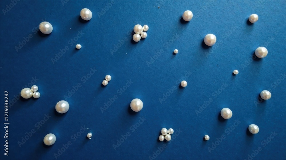 Aufkleber An array of lustrous white spheres scattered across a deep blue backdrop, creating a visually appealing and elegant arrangement.
