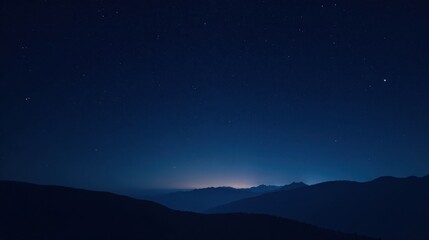 Fototapeta premium Serene Nightscape Starry Sky Over Silhouetted Mountain Range