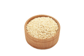 Raw sesame seeds in wooden bowl isolated on white background.