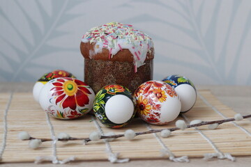 Beautifully styled Easter table with hand-decorated eggs, festive cake, and natural willow branches, perfect for holiday marketing campaigns, lifestyle blogs, or social media content.
