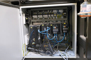 in a switch cabinet with fuses, frequency converters and terminal strips for controlling an...