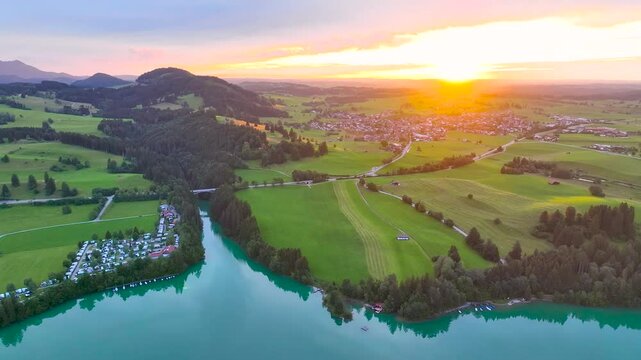 Aerial view of the Lake Forggensee in Alps in the evening, Germany, Europe