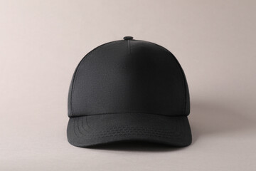 Stylish black baseball cap on light grey background. Mockup for design