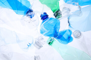 Crumpled plastic bottles on white background, closeup