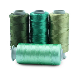 Spools of colorful sewing threads isolated on white